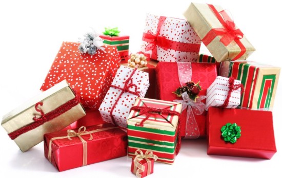 A pile of Christmas gifts in colorful wrapping with ribbons.